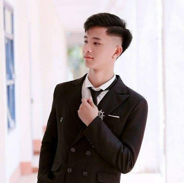 Young Man in Elegant Black Suit — © SIGIL