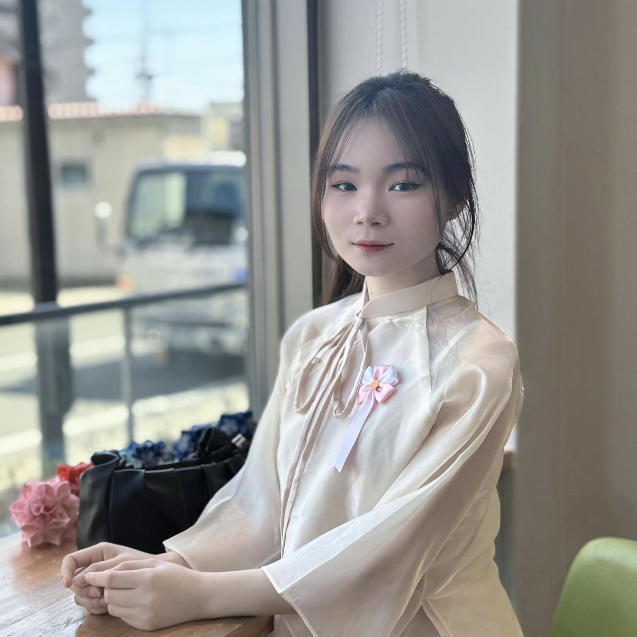Woman in Cream Silk Ao Dai by the Window — © SIGIL